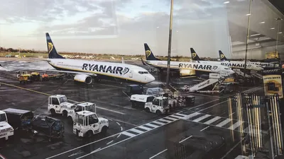 A photo from inside the airport of a Ryanair plane